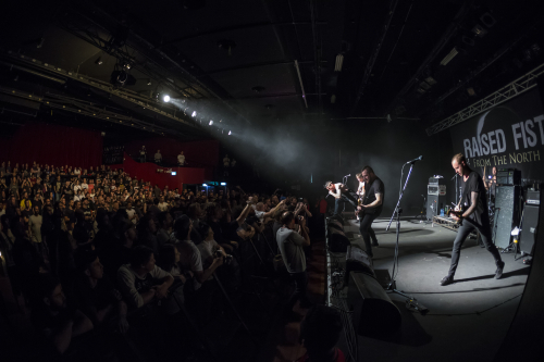 raised fist the metro 16